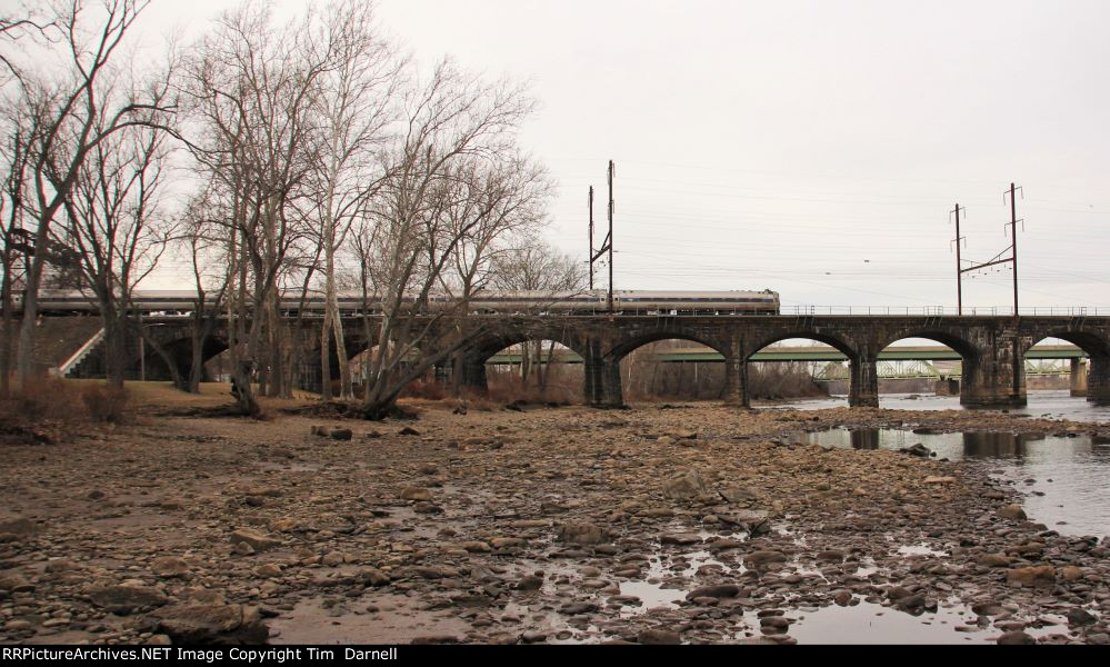 Cab car passes over a very low Delaware river.
